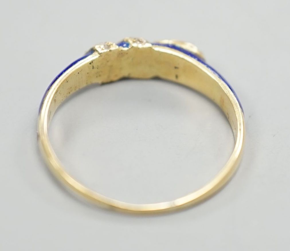 A late Victorian yellow metal, blue enamel and rose cut diamond set serpent ring, size O, gross weight 2.5 grams.